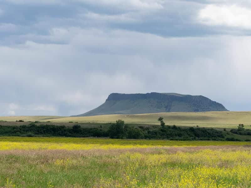 AdobeStock_484796426 Montana ranch landscape with mountains